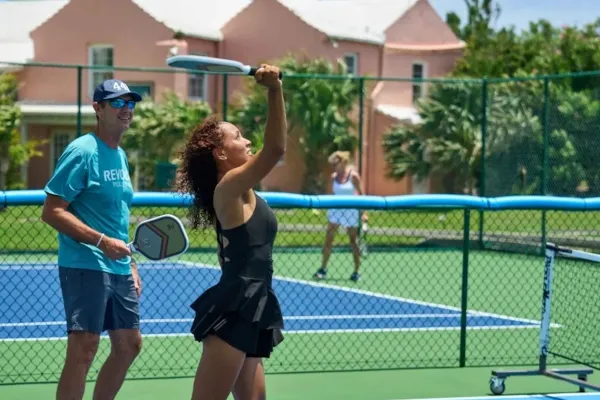 A couple playing tennis