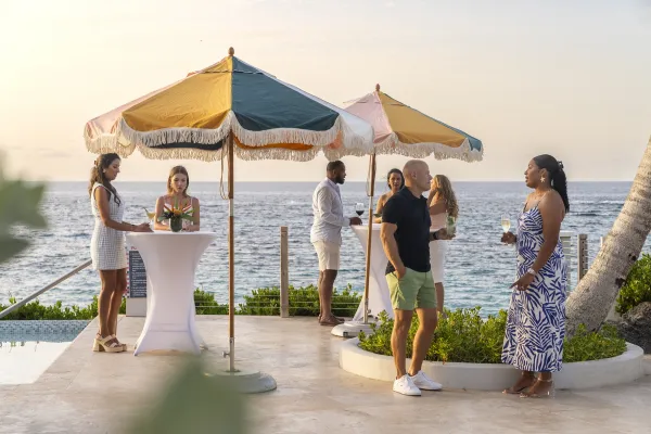 People enjoy a cocktail hour on the patio at the Loren hotel