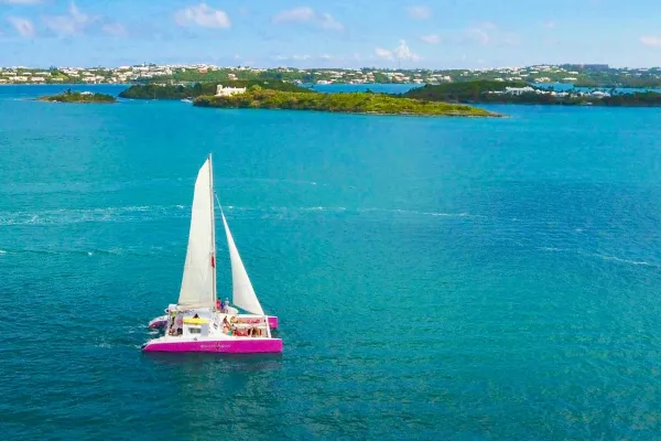 The Restless Native catamaran sailing in a Bermuda bay
