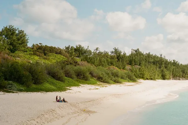 A group of people from afar on a Bermuda beach