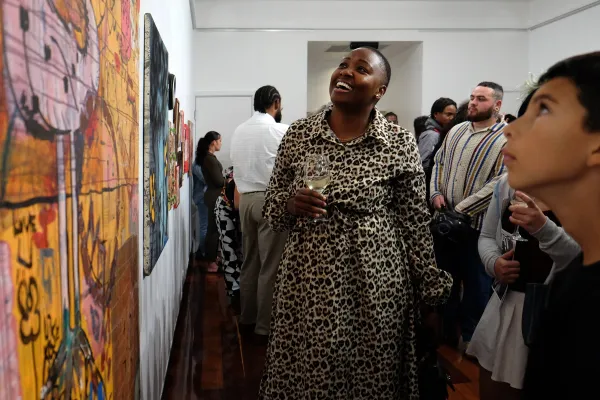 Patrons admire art at a gallery in Bermuda