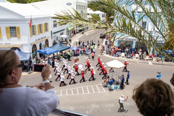Spectators view the Bermuda Day parade from above on a balcony