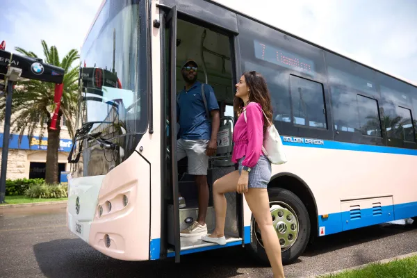 A woman boarding onto a Bermuda city bus