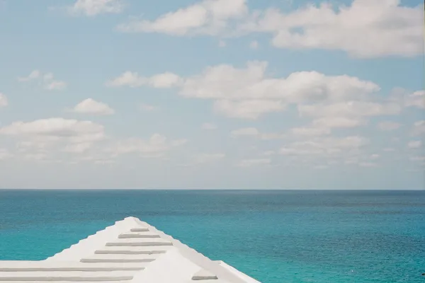 A white triangular rooftop overlooking the ocean in Bermuda