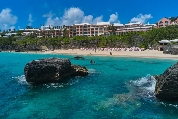 View of the Reefs Resort from the shoreline, as swimmers and kayakers enjoy the beach below