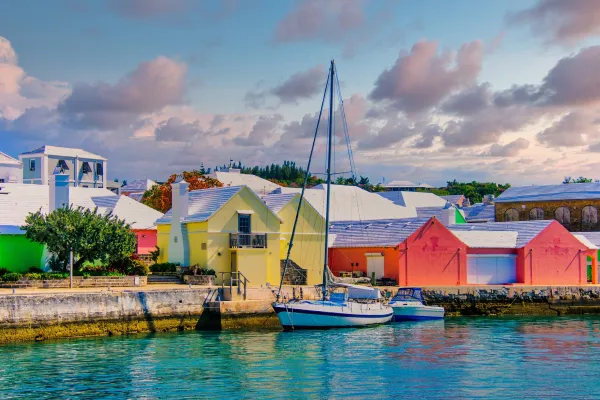 Colourful buildings near a dock where a boat is anchored in Bermuda