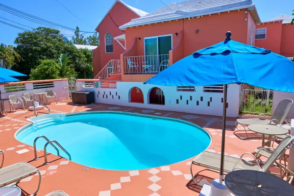 A terrace with a pool at Dawkins Manor