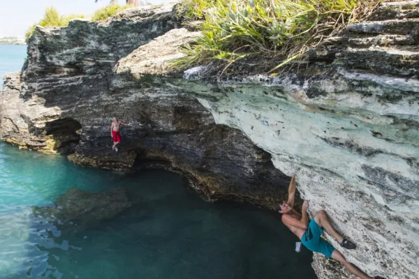 A person climbing a cliff face in Bermuda