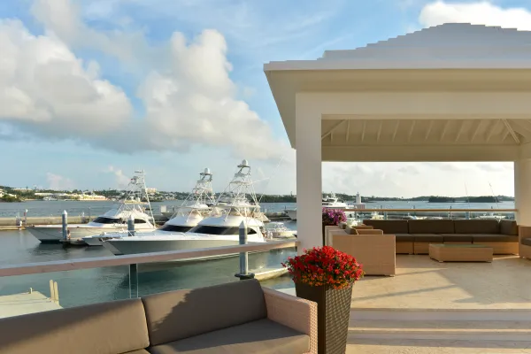 Superyachts docked near a Bermuda patio