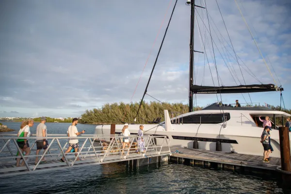 People boarding a docked Super Yacht in Bermuda