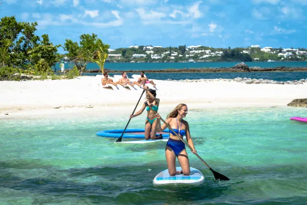 A group of people enjoying a private island beach day.