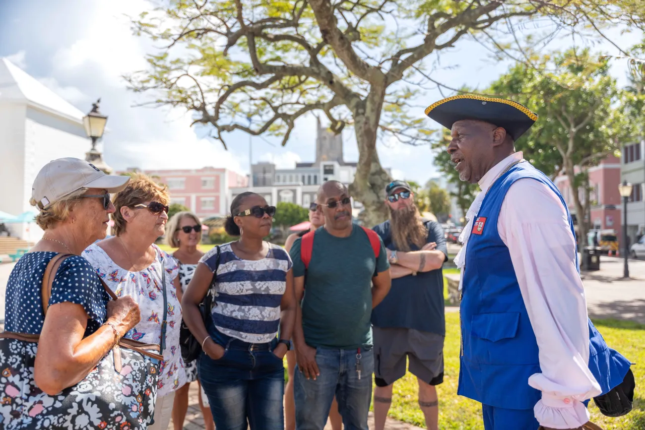 Town Crier is giving a tour outside of City Hall