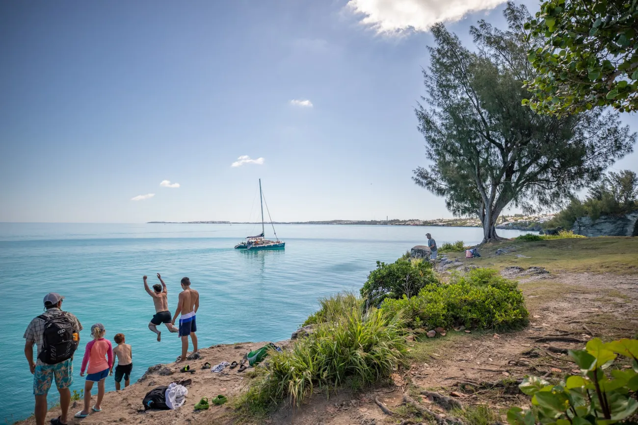 A group cliff jumping in Bermuda