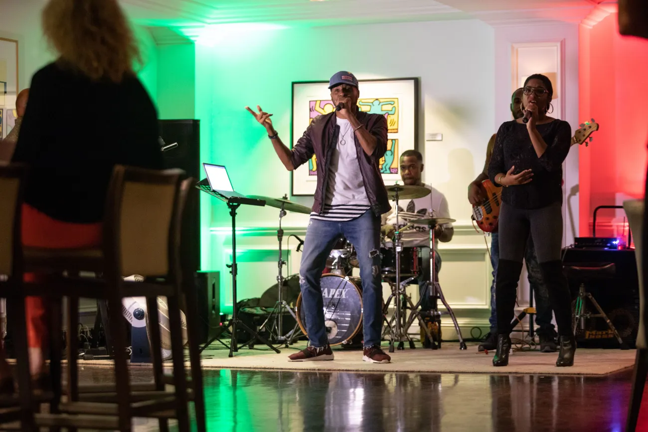 A band is performing in front of a crowd.