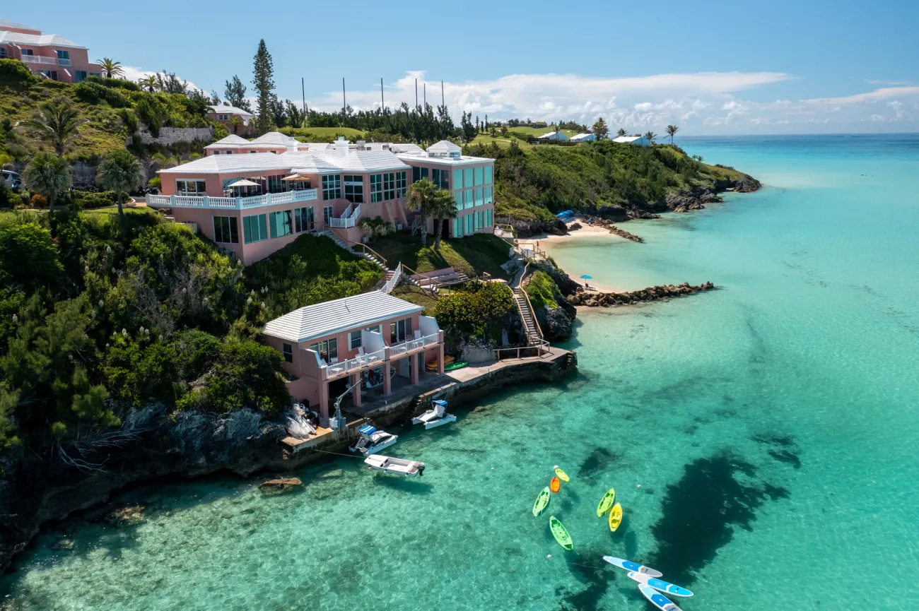 An aerial view of Pompano Beach Club with an empty beach and clear calm waters.