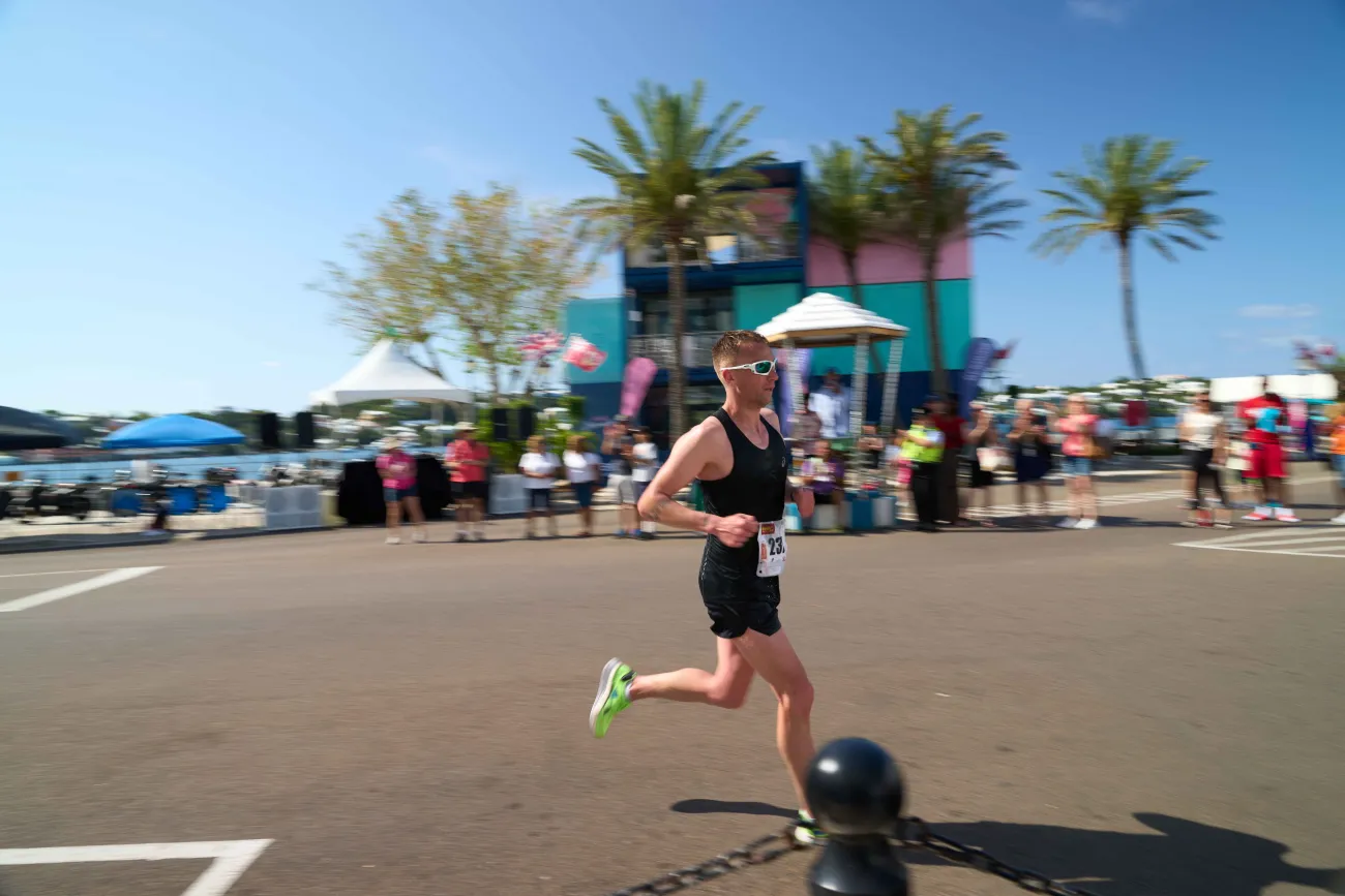 A man is running on front street by the VSC on Bermuda Day