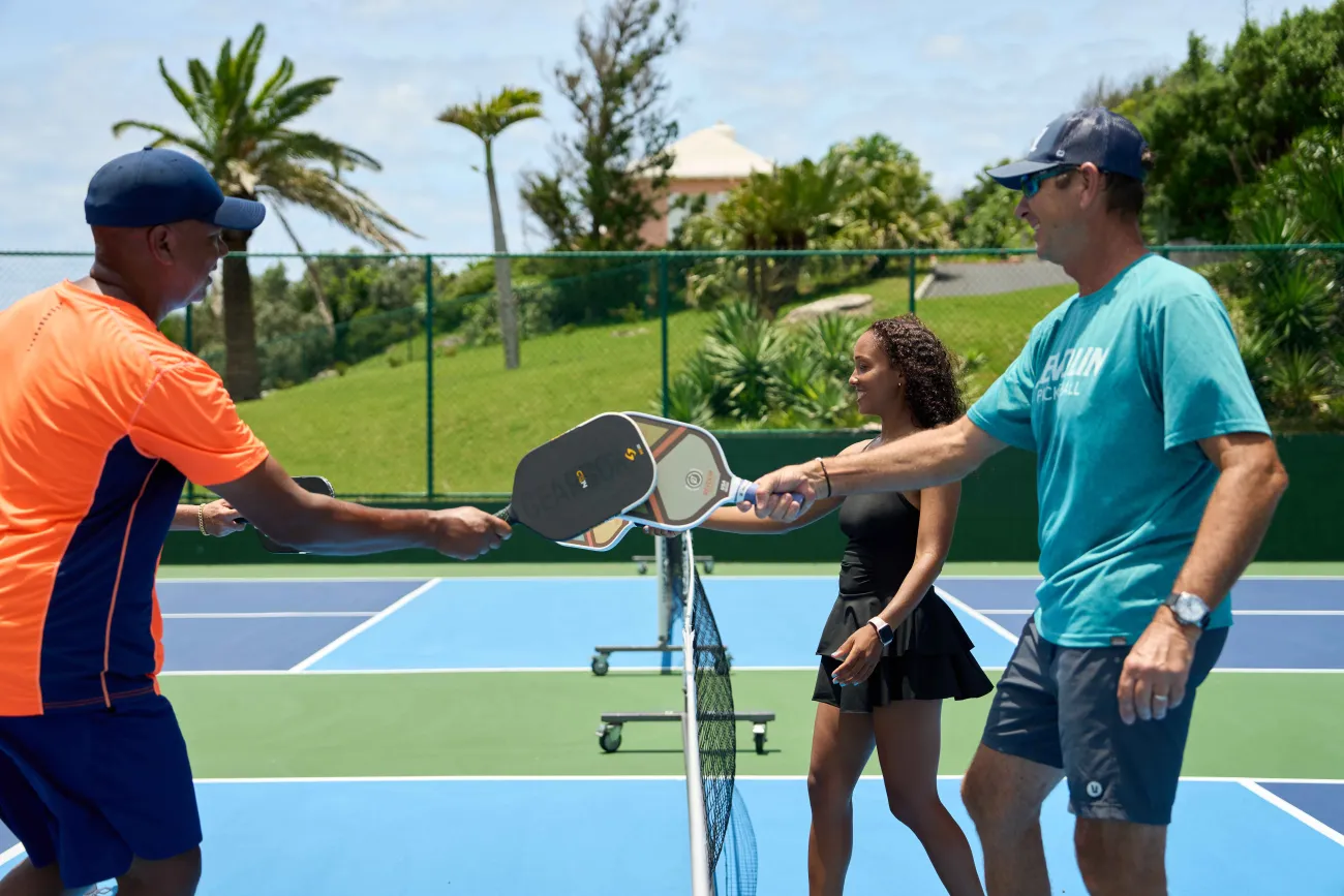 A group is playing pickleball.