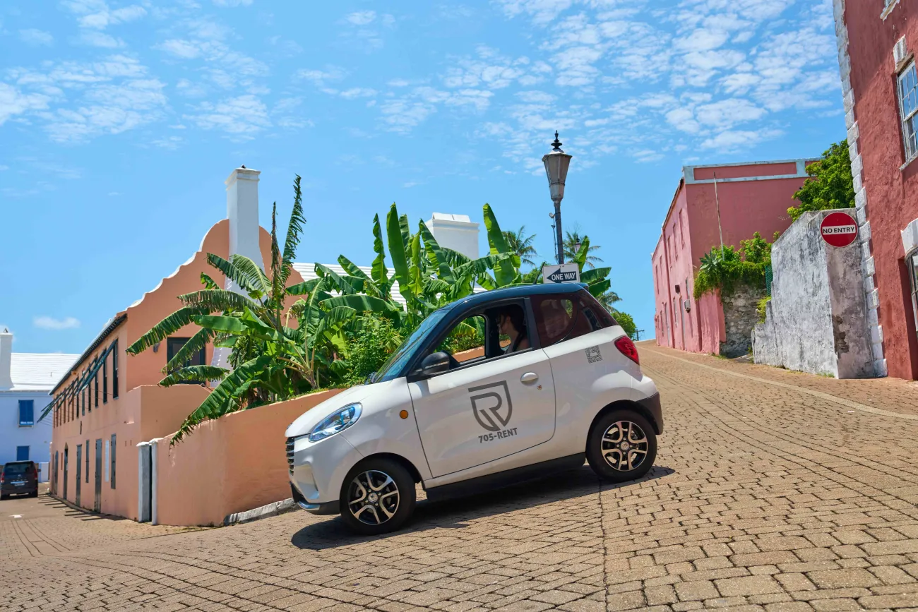 A microcar is driving around St. George's
