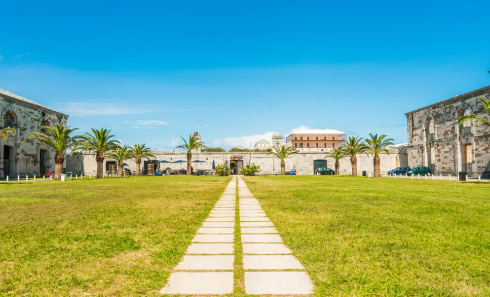 Stone pathway in the grass leading to a building