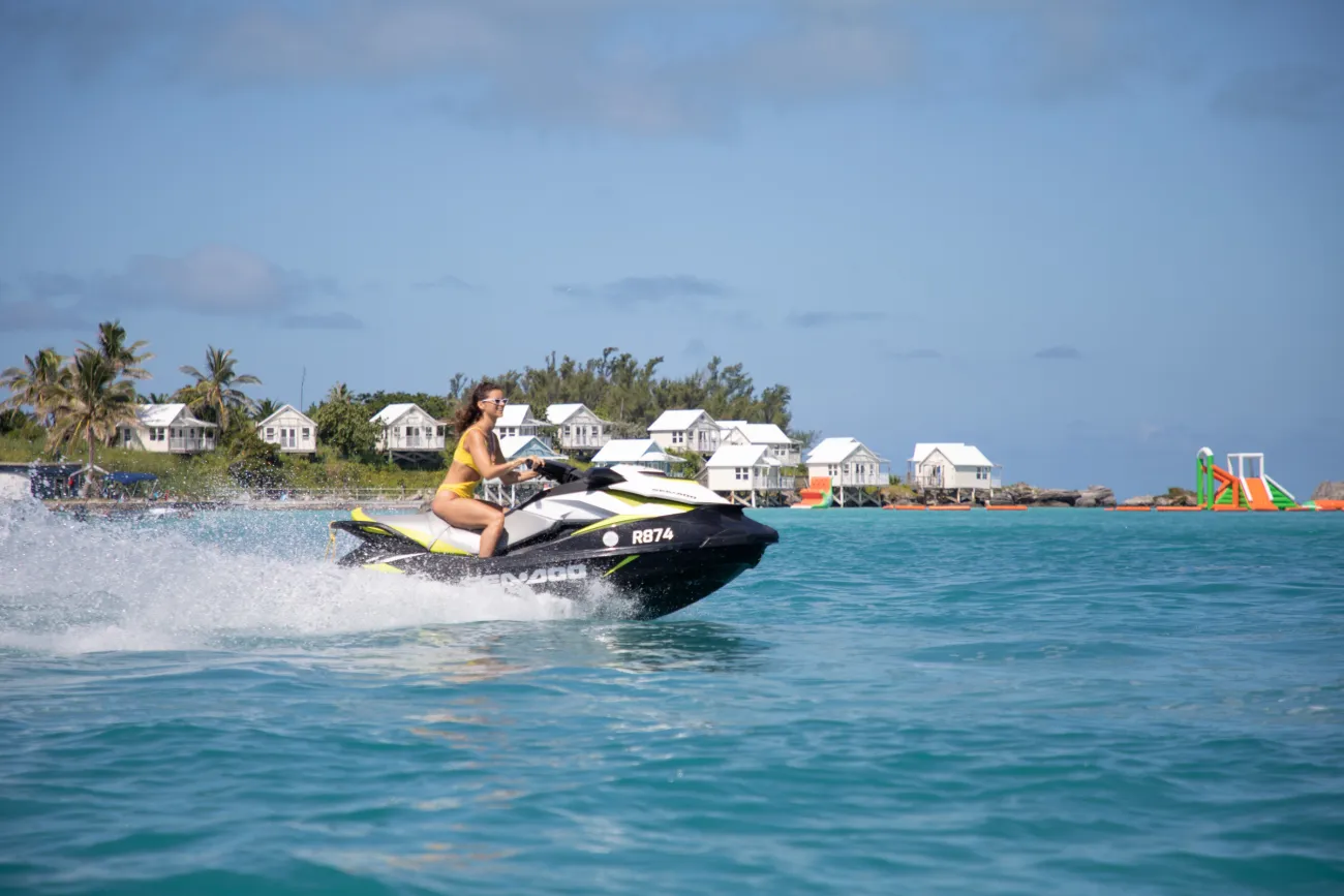 A woman is riding a jetski.
