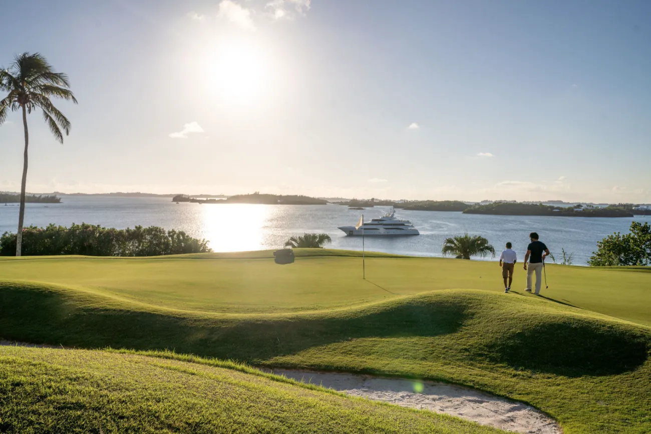 An aerial view of a dad & son playing golf