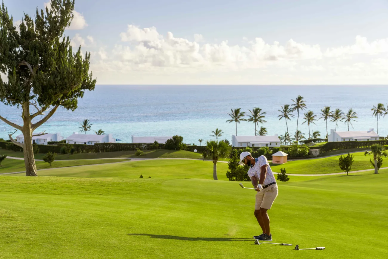 A man is playing on the golf course.