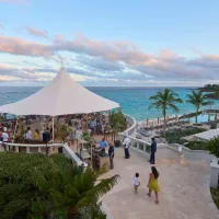 A group of people gathering in a gazebo overlooking the ocean in Bermuda